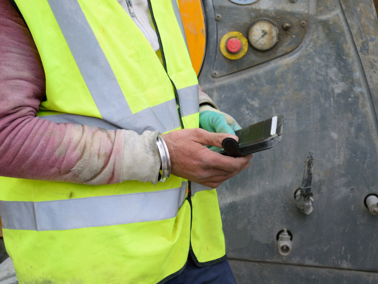 Construction worker using phone