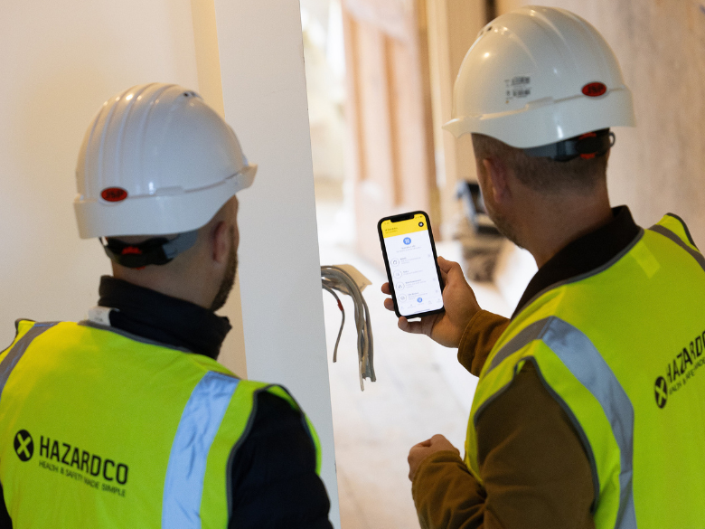 Two construction workers using HazardCo