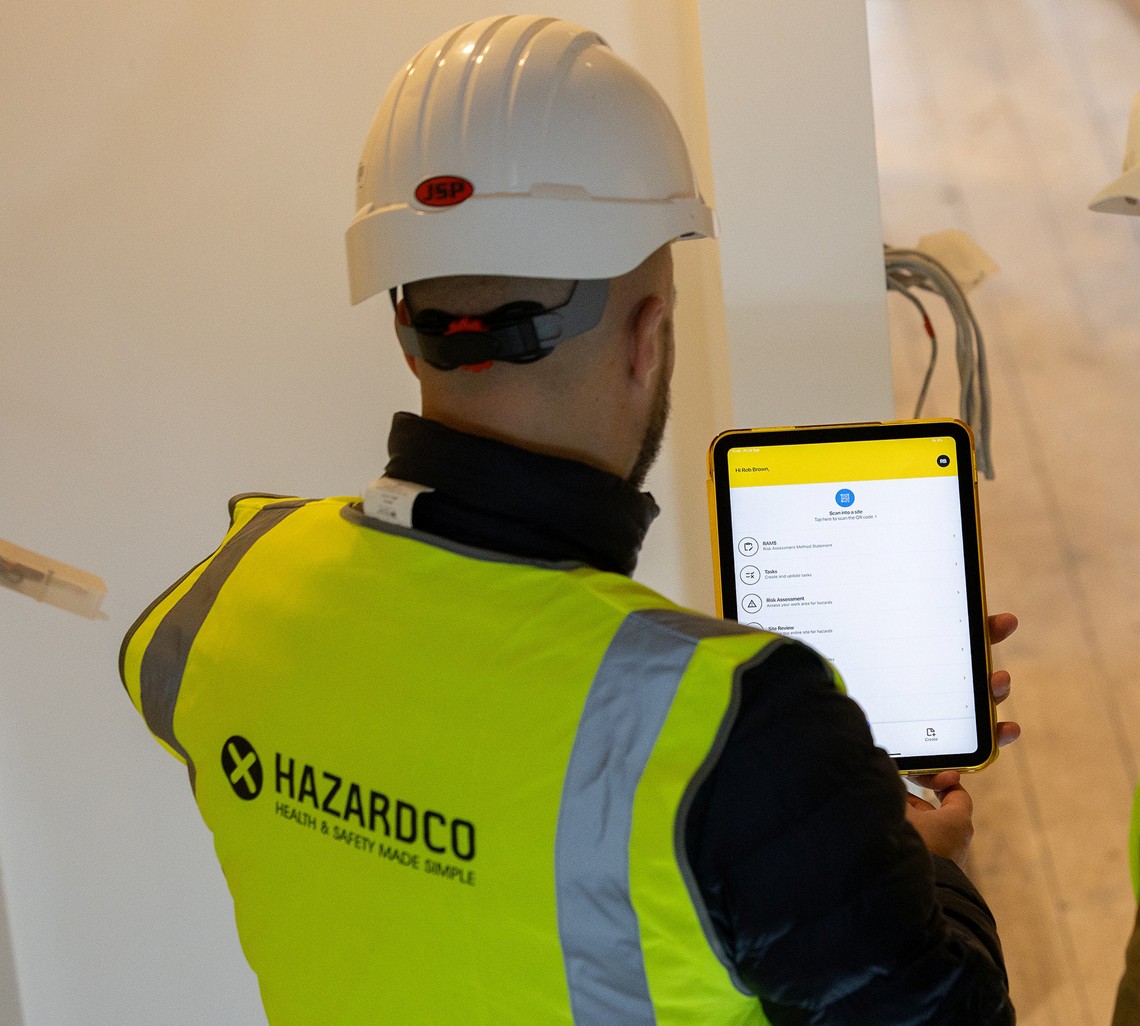 Construction worker using the HazardCo app for RAMS