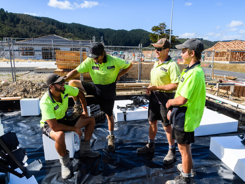 Construction workers having a meeting on site